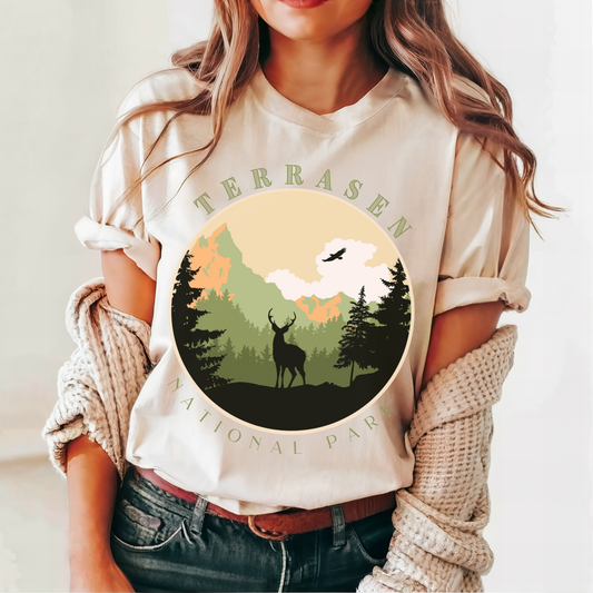 Soft cream Terrasen National Park t-shirt with circular stag badge — Throne of Glass merch inspired by Sarah J. Maas