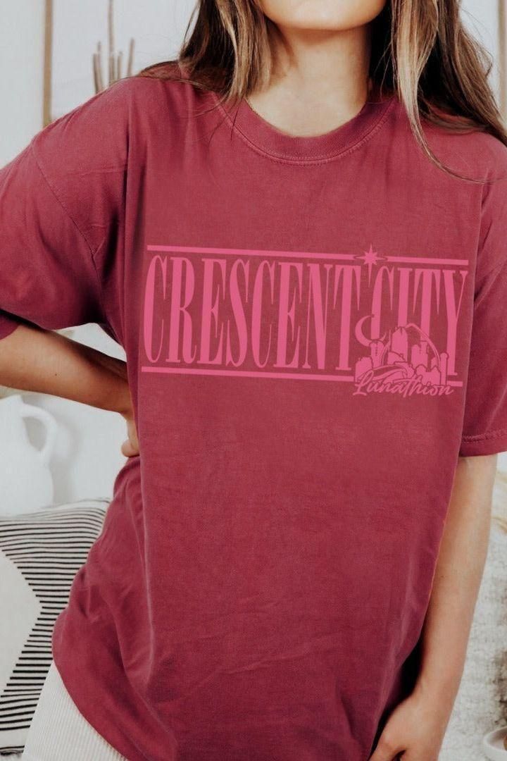 Crescent City Heavyweight Shirt — Crescent City merch by Sarah J. Maas. The city of Bryce, Hunt, and the Asteri-burning truth. Hand-designed in Australia, officially licensed.