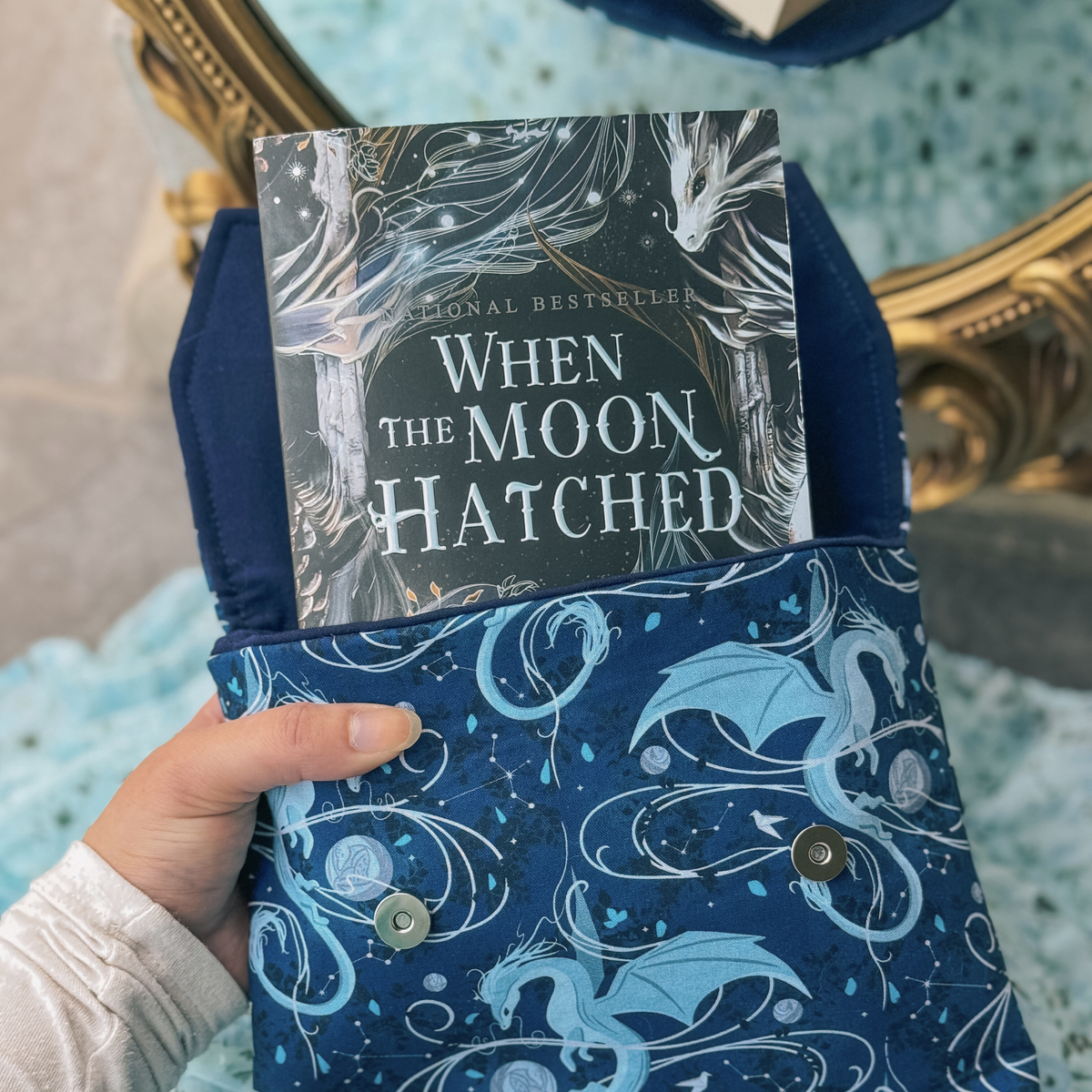 Moonplume Dragon padded book sleeve (When The Moon Hatched)