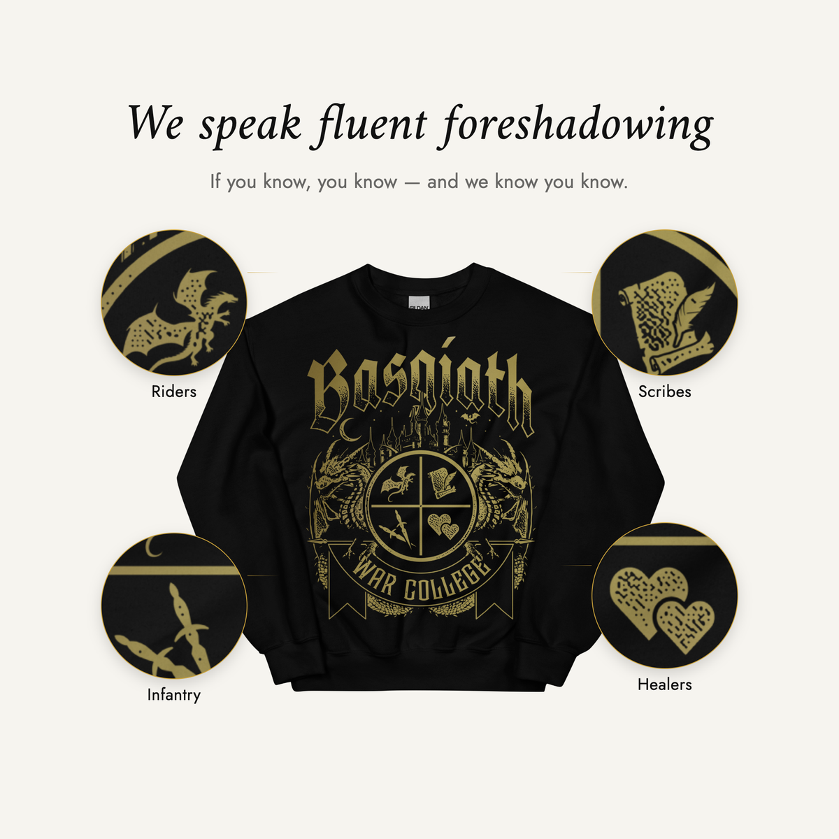 We speak fluent foreshadowing — the black Basgiath War College sweatshirt with the four quadrant emblems magnified: Riders, Scribes, Infantry and Healers