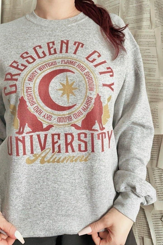 CC Alumni Sweatshirt — Crescent City merch by Sarah J. Maas. CCU forever — even in exile. Hand-designed in Australia, officially licensed.
