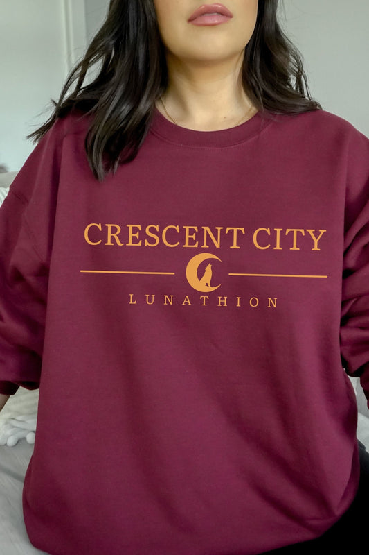 Crescent City Sweatshirt — Crescent City merch by Sarah J. Maas. Bryce, Hunt, and the Asteri-burning truth. Hand-designed in Australia, officially licensed.
