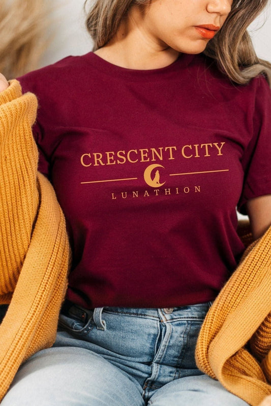 Crescent City T-Shirt — Crescent City merch by Sarah J. Maas. Bryce, Hunt, and the Asteri-burning truth. Hand-designed in Australia, officially licensed.