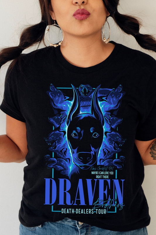 Model wearing a black Draven Brothers t-shirt with an electric blue dog head ringed by wolves and panthers, inspired by The Bonds That Tie by J Bree