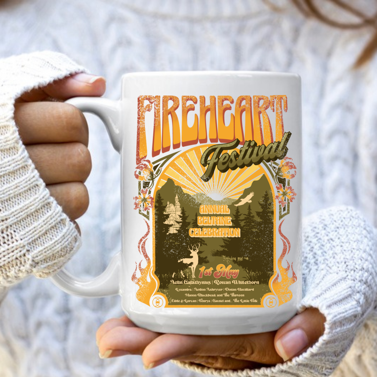 Hands in a knit sweater holding a white Fireheart Festival mug, inspired by Throne of Glass by Sarah J. Maas