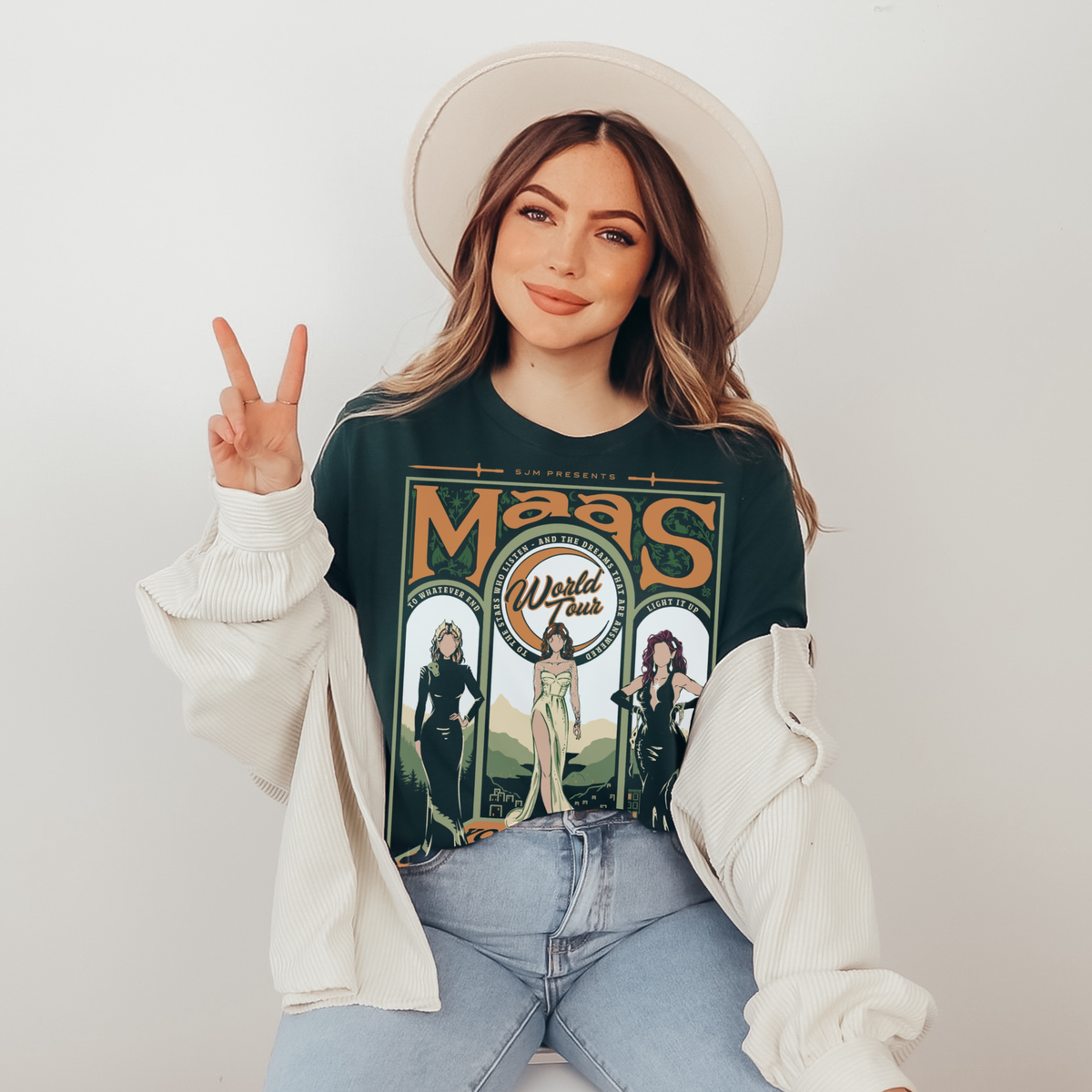 Model wearing the forest green Maas World Tour t-shirt — merch inspired by the worlds of Sarah J. Maas
