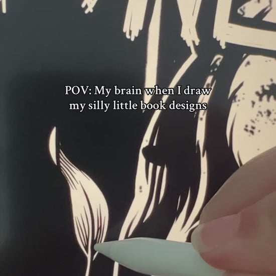 Behind the scenes: the Bone Carver artwork being drawn — the ragged 'THE BONE CARVER' lettering, the 'I am forgotten' skull and the bones inked in, captioned 'POV: my brain when I draw my silly little book designs' [focal 50 45]