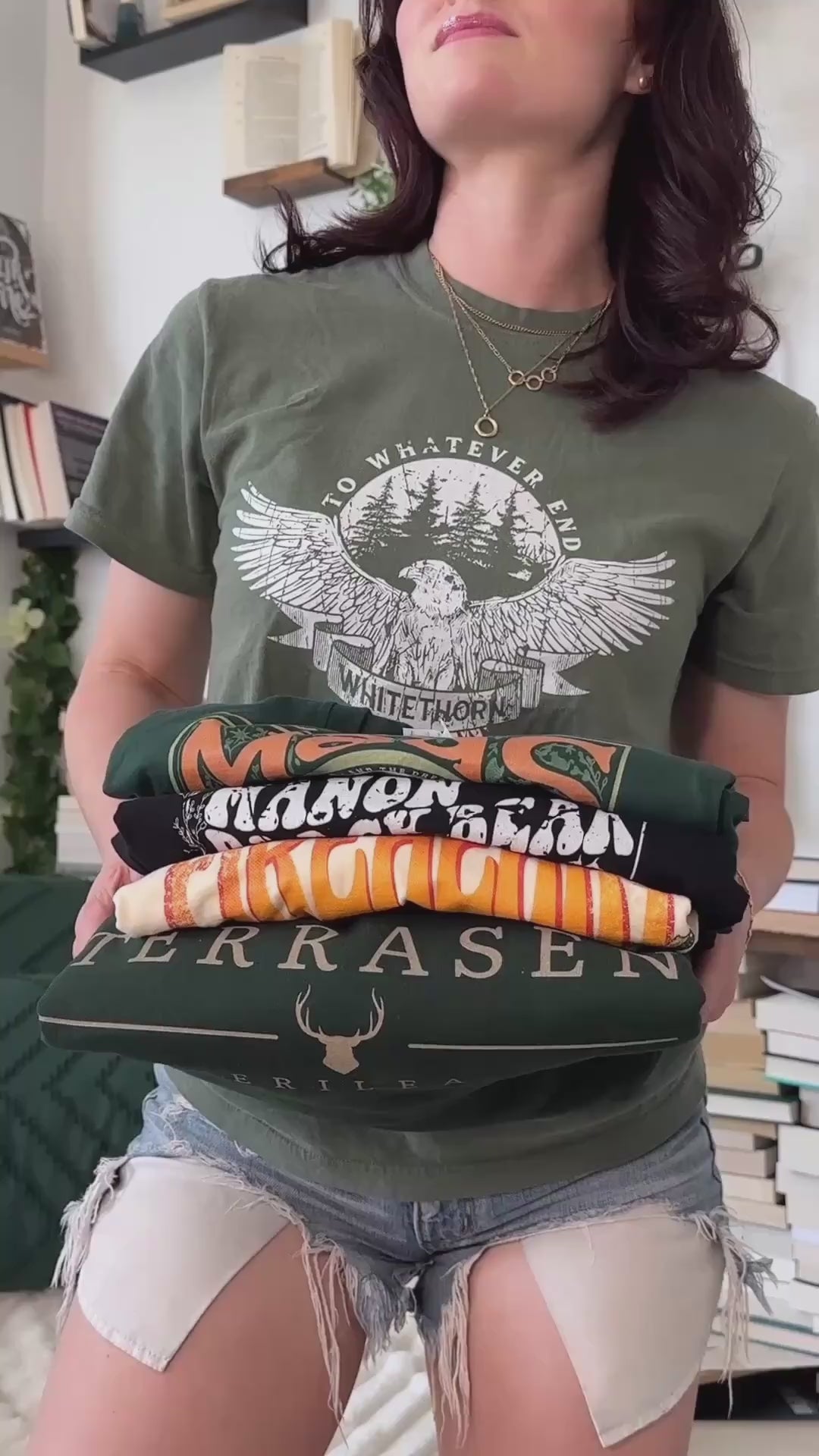 Try-on video: the Rowan Whitethorn tee worn, held with the Maas, Manon Blackbeak, Fireheart and Terrasen designs