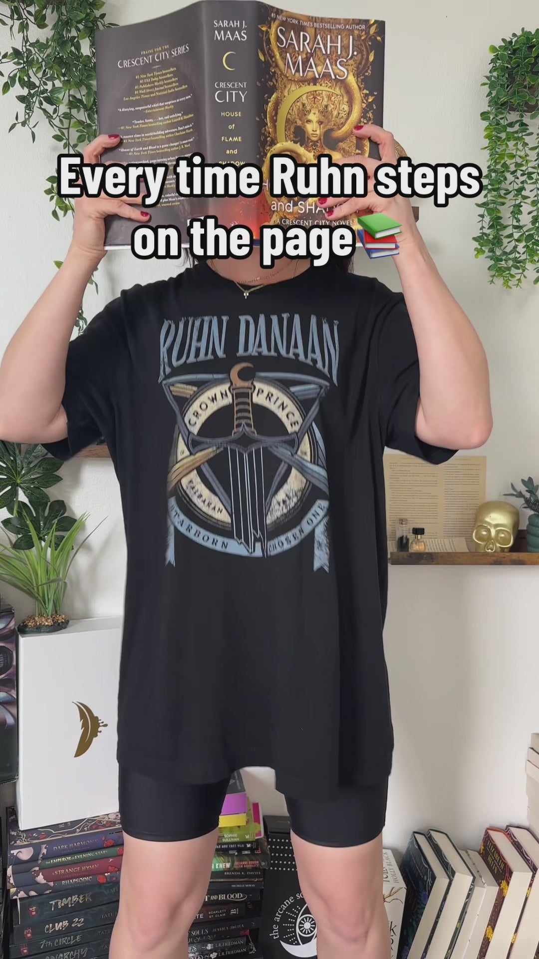 Try-on video: the black Ruhn Danaan t-shirt — the RUHN DANAAN lettering above the crossed sword and staff with the CROWN PRINCE roundel [focal 50 42]