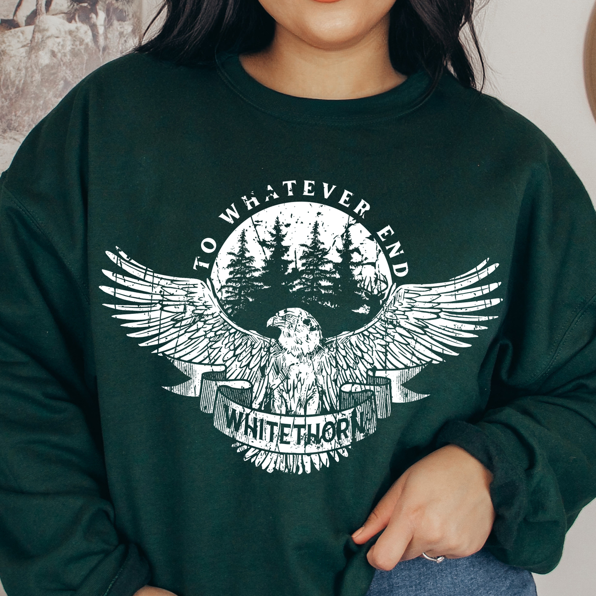 Model wearing the forest green Rowan Whitethorn sweatshirt — Throne of Glass merch inspired by Sarah J. Maas