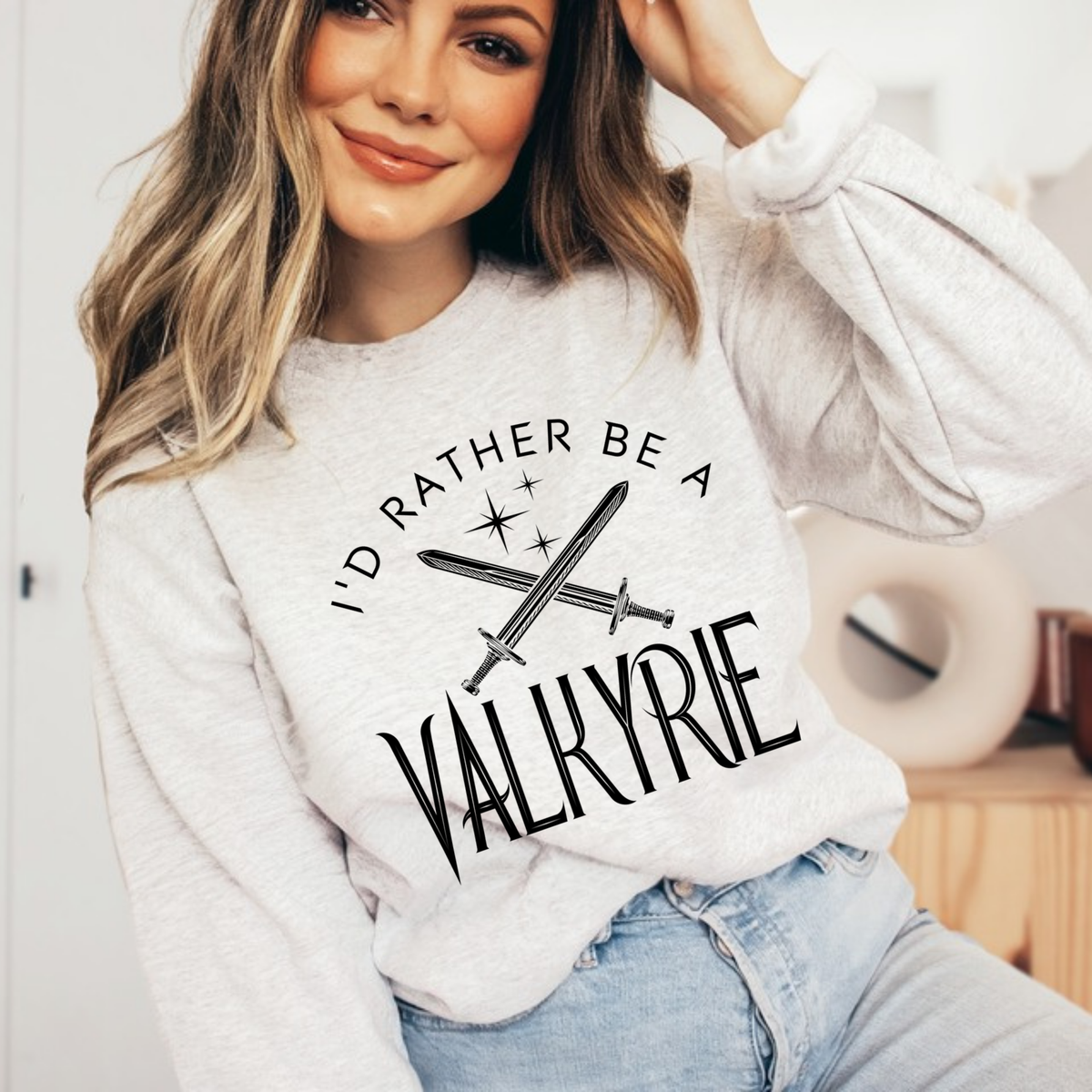 Model in an ash grey I'd Rather Be a Valkyrie sweatshirt, ACOTAR merch inspired by Sarah J. Maas