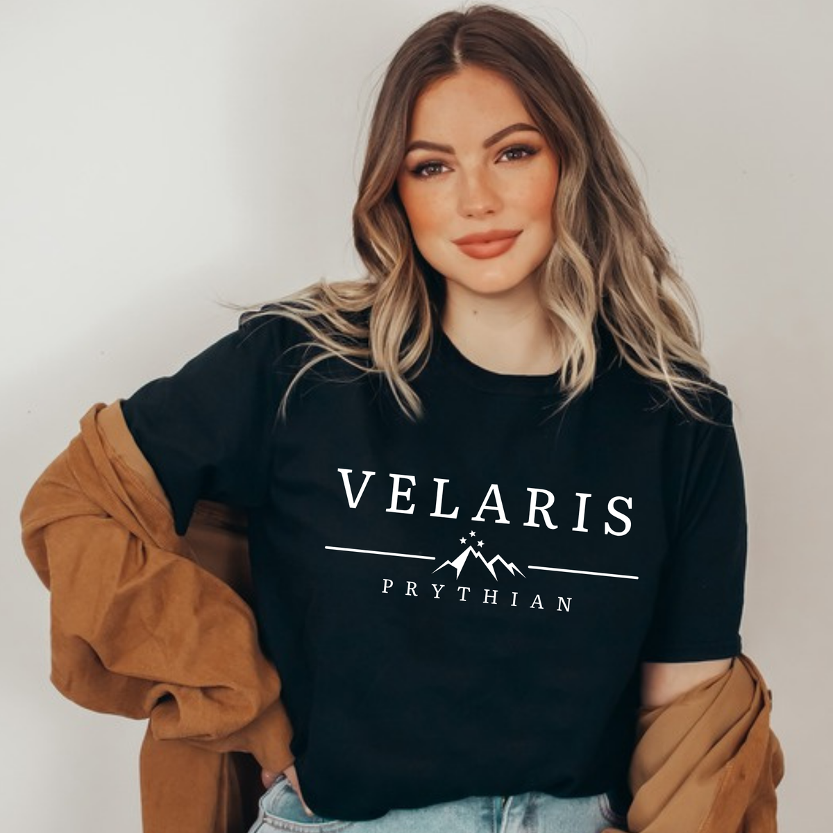 Model in a black Velaris Prythian t-shirt, ACOTAR merch inspired by Sarah J. Maas
